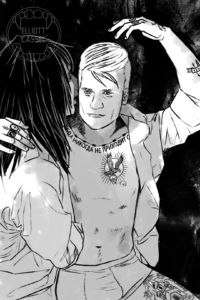 A young white man with long black hair cuddles a man with open shirt, tattoos, and short blond hair as the tattooed man is staring at the viewer.